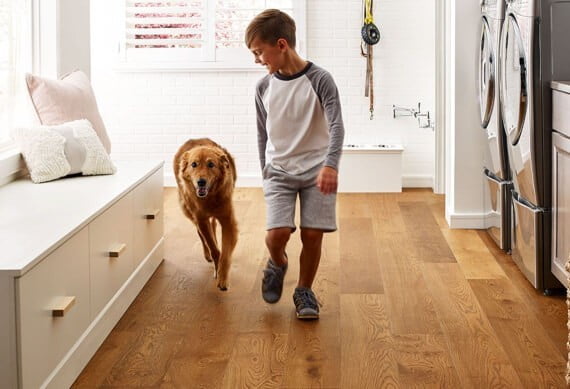 Kid running with dog | Big Bob's Flooring Outlet Yuma